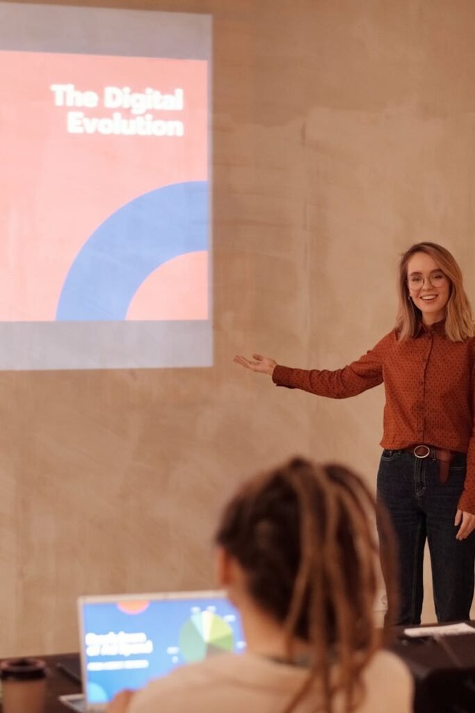 Young woman presenting on digital evolution concepts like AI and big data in a seminar.